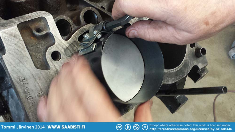 Pushing the piston in with an installation tool. Tommi's Saab Site